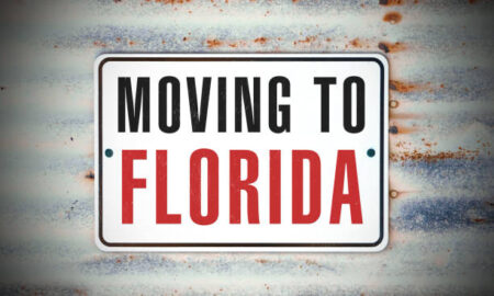 rustic sign that says "Moving to Florida."